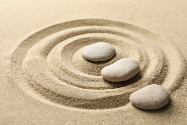 Stones on the sand with patterns. Zen concept