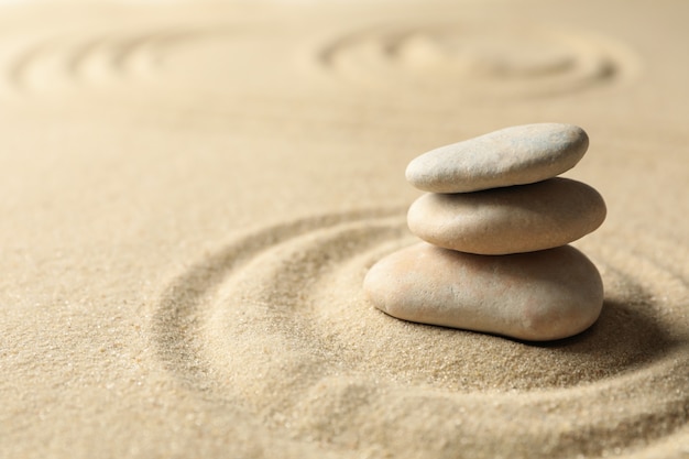 Stones on the sand with patterns