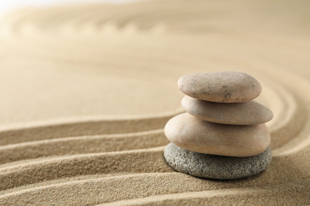 Stones on the sand with patterns