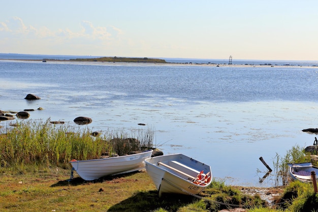 Stones in the water old wooden pier with boats