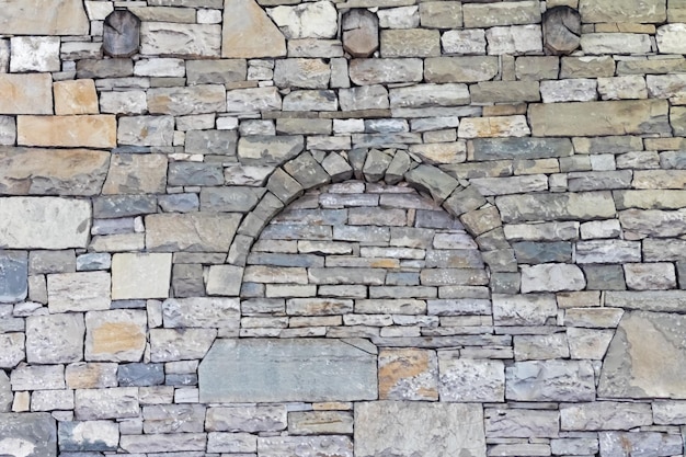 Stonework with asymmetry with a semicircular bend and three circles