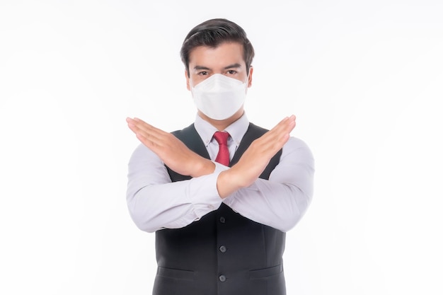 Stop Civid-19, Aziatische man met gezichtsmasker toon stop handen gebaar voor stop corona virus uitbraak, bescherm verspreiding Covid-19 Coronavirus en bescherm pm 2.5 concept