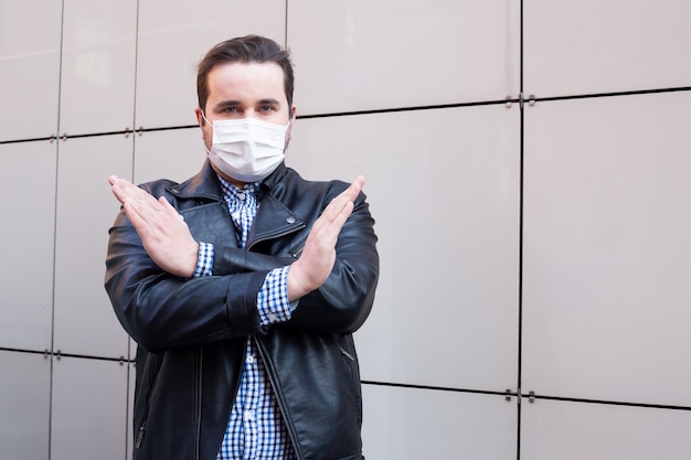 Photo stop panic, stay home. man in medical mask, health care concept. coronavirus quarantine.