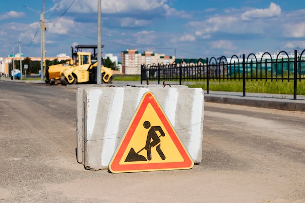 A stop road sign and concrete blocks block the entrance to the construction site Closed road Construction and road works