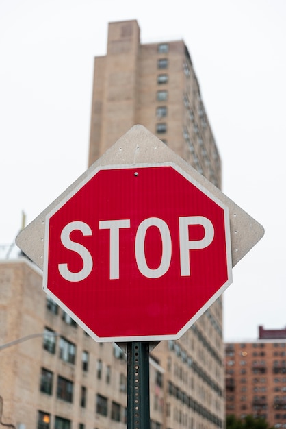 Photo stop road sign with blurred building background