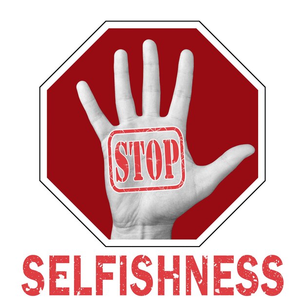 Photo stop selfishness conceptual illustration. open hand with the text stop selfishness. global social problem