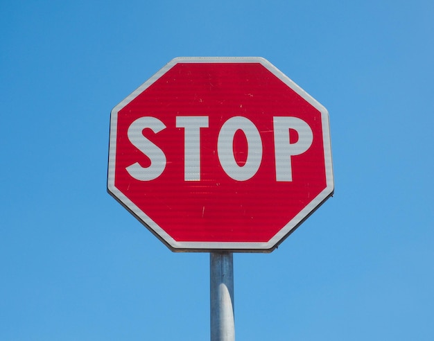 Stop sign over blue sky