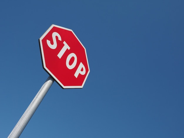 Stop sign over blue sky