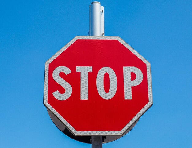 Stop sign over blue sky