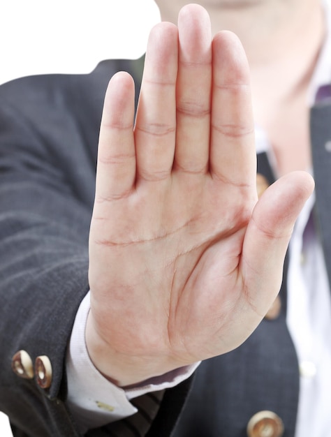 Stop sign by one palm businessman hand gesture