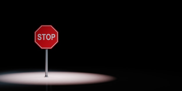 Foto stop verkeersbord in de schijnwerpers geïsoleerd