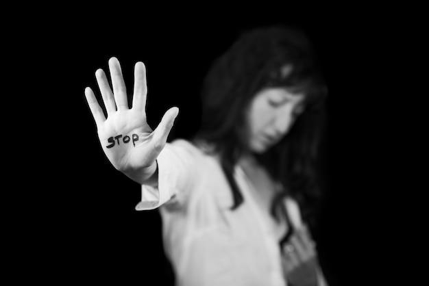 Stop violence against women. Hand saying stop