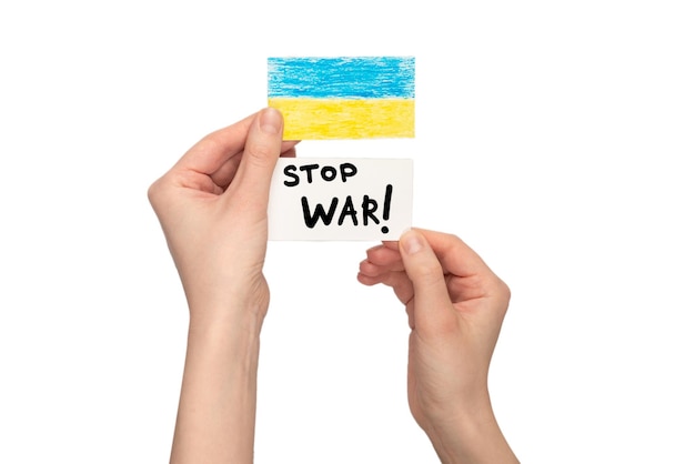 stop war text on a card isolated on a white background in woman hands