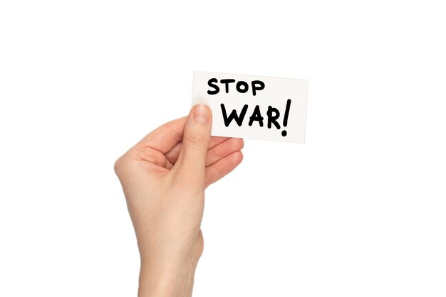 stop war text on a card isolated on a white background in woman hands