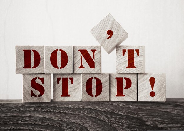 Don't Stop written on a wooden cubes Business startup motivation encouraging concept