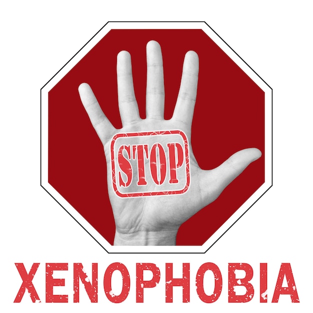 Stop xenophobia conceptual illustration. Open hand with the text stop xenophobia. Global social problem