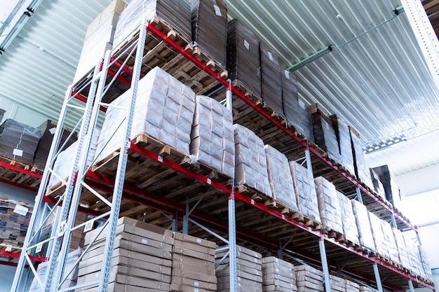 Photo storage warehouse and racks on which there are cardboard boxes with finished products