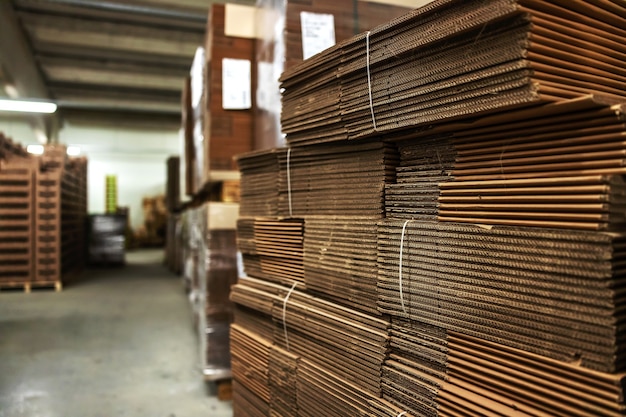 Storage with stocks of unpacked cardboard boxes for packing goods