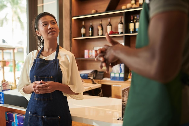 Photo store worker talking to manager