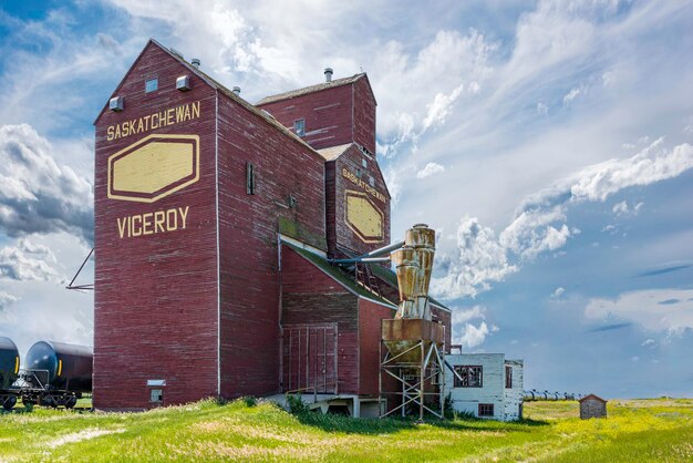 Storm clouds over an abandoned grain elevator in the ghost town of Viceroy Saskatchewan Canada