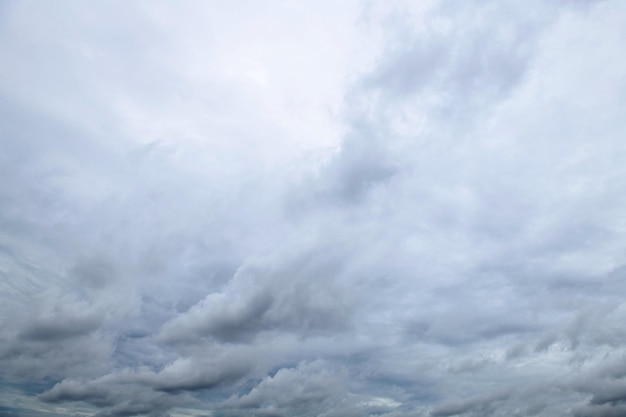 Storm clouds floating in a rainy day with natural light Cloudscape scenery overcast weather above blue sky White and grey clouds scenic nature environment background
