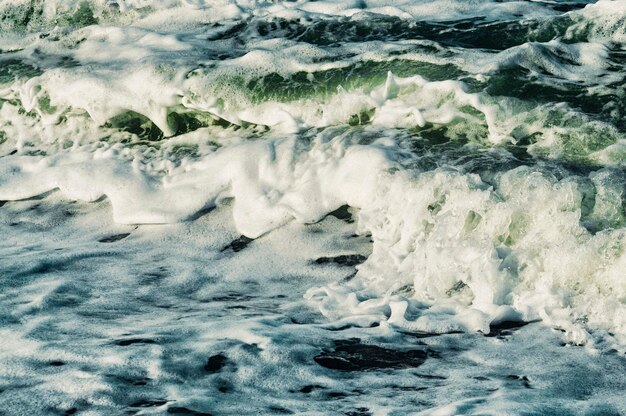 Storm at the sea. Blue water background.