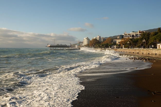 Storm at the sea and embankment street in the morning on Big waves and tides