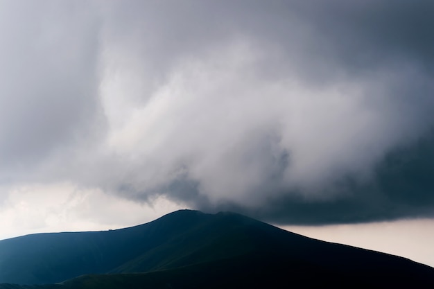 Stormy clouds above mountains