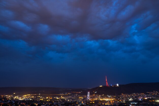 Stormy clouds over the night city