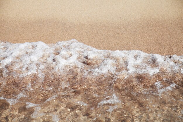 Stormy sea background.Waves and splashes.Sandy beach.