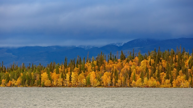 Stormy weather over the Khibiny mountains. The first snow on the top of the rocks.