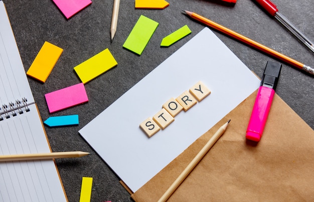 Story letters on paper sheet and notes around on a table