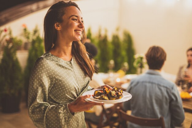 Photo storytelling footage of a multiethnic group of people dining on a rooftop. family and friends make a reunion at home