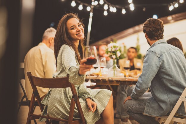 Storytelling footage of a multiethnic group of people dining on a rooftop. Family and friends make a reunion at home