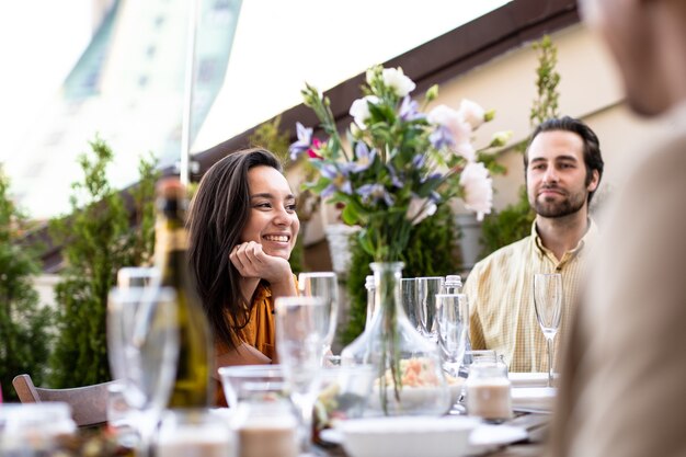 Storytelling footage of a multiethnic group of people dining on a rooftop