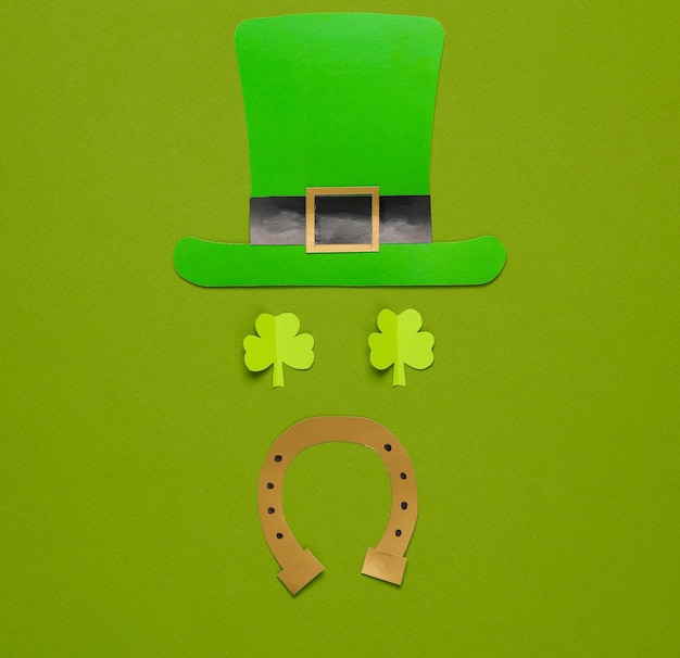stpatrick s day face from a leprechauns hat on a green background sreative layout
