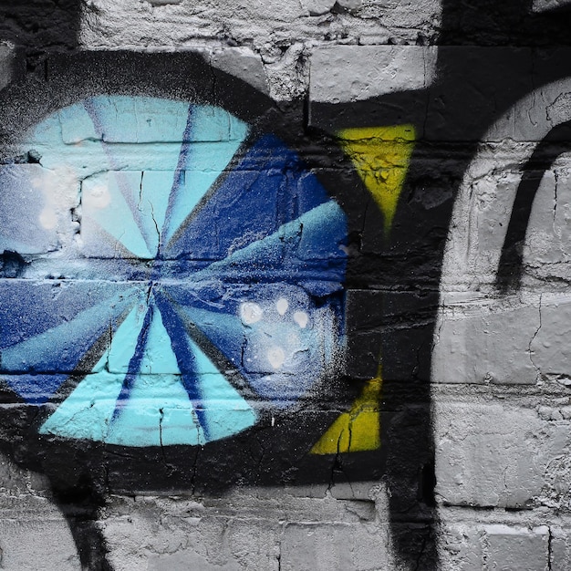 Straatkunst Abstracte achtergrondafbeelding van een fragment van een gekleurd graffiti schilderij in chroom en blauwe tinten