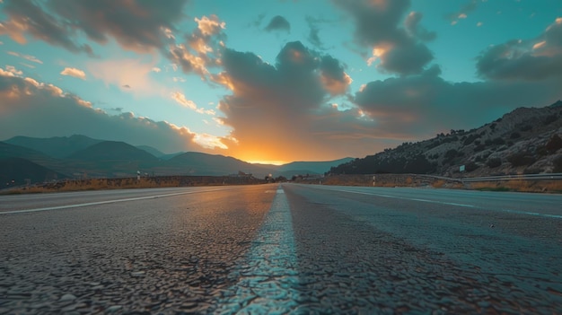 Straight asphalt road and mountain with sky clouds background at sunset