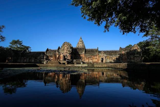 Straight front Phanom Rung Rock Castle water reflection.