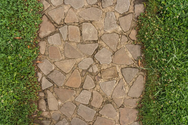 Photo straight line of stone pavement and lawn on both sides top view