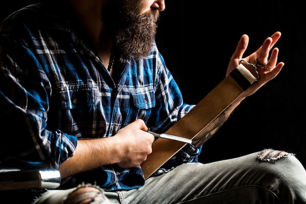 Straight razor. Vintage tools for barbers, razor, sharpen the blade in leather brush, razor blades.