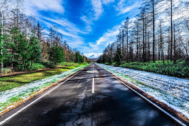 A straight road overlooking Mt Tokachi Hokkaido Japan