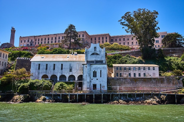 Straight on view of prison on Alcatraz Island from just offshore in San Francisco Bay