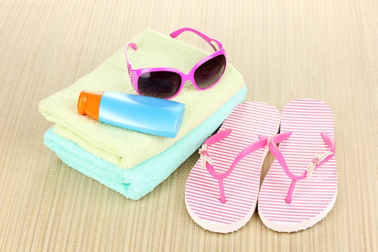 Foto strandaccessoires op de mat