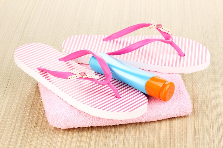 Foto strandaccessoires op de mat