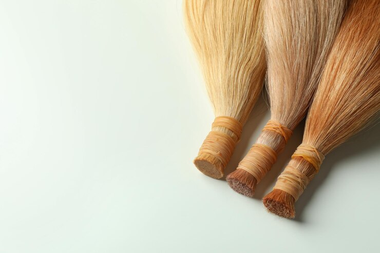 Strands of hair on white background close up