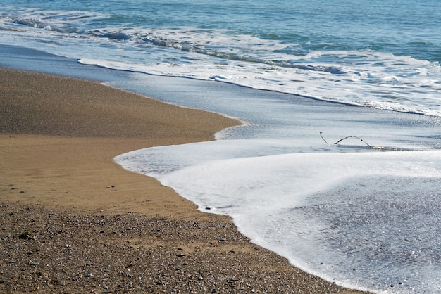 Strandzand en golf