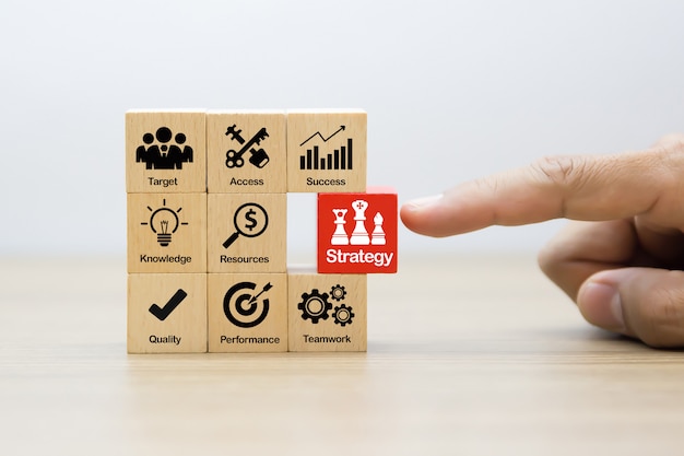 Strategy Business Concept icons on Wooden Blocks.