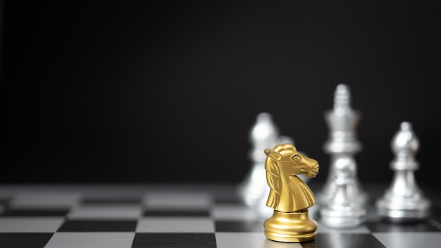 Strategy and business planning ideas Chess horse gold on the board