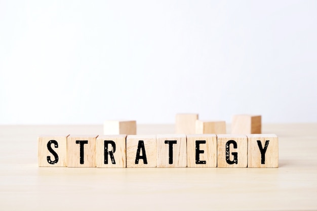 Strategy word on wooden cubes, business concept